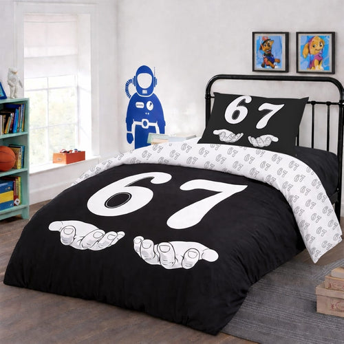 6-7 reversible twin duvet cover set on black bed frame in kids bedroom, bold white number 67 design