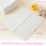 White cotton muslin baby washcloth showing size and texture, soft breathable cloth for newborn bath time