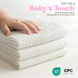 Folded white muslin baby washcloths showing soft layered texture, gentle cotton cloths for baby bath and skincare